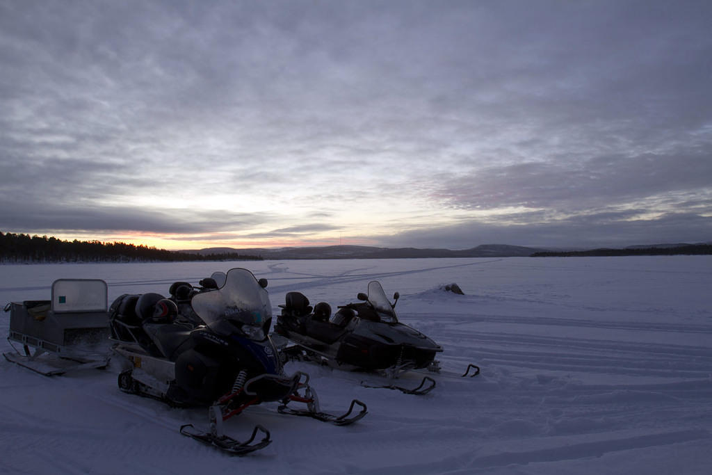 Snowmobiling on Lake Inari on our way to ice fishing