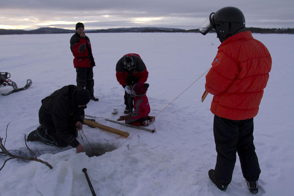 Re-threading the net under the ice