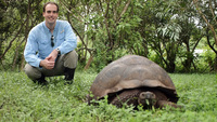 Posing with a Galapagos Tortoise