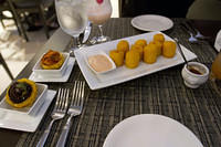 A blood sausage tart, a shrimp tart, and fried cheese in corn bread