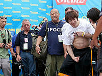 Even after eating 63 hotdogs, Kobayashi can still show off his abs.